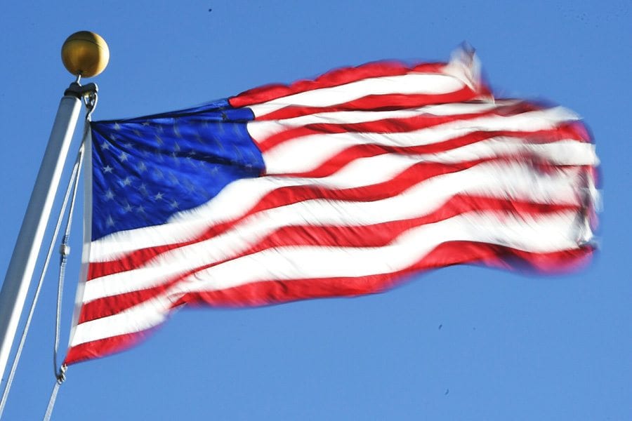 High winds bulow the American flag flying over Rio Norte Junior High School in Valencia on Friday. Dan Watson/Signal
